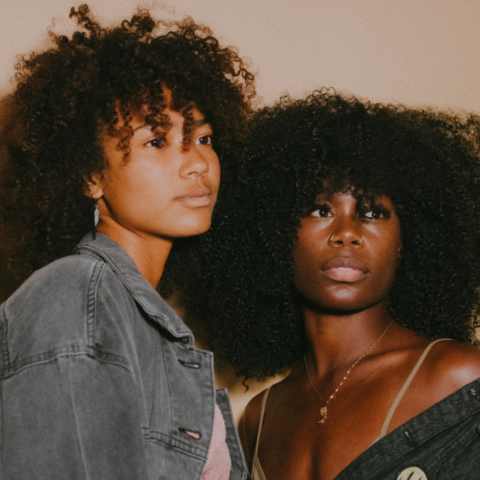 Black women looking hopeful