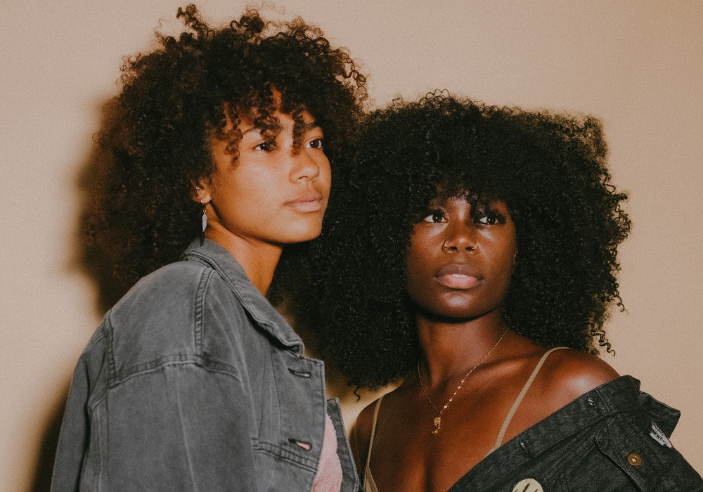 Black women looking hopeful